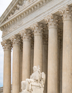 Authority of Law supreme court sculpture. Classical architecture heritage exterior. Law lex constitution judicial governance. Historic landmark justice.