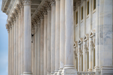 Columns stone architectural perspective symmetry. Columns marble fluted repetition. Columns decorative capitals carved detail. Columns classical facade. © Svitlana