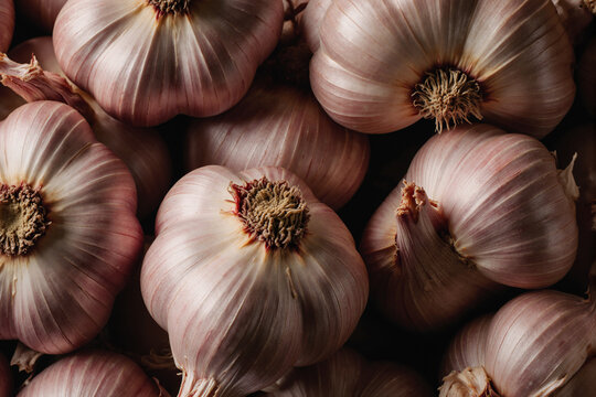 Fresh peeled garlic cloves as background, closeup