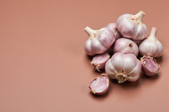 Fresh peeled garlic cloves as background, closeup