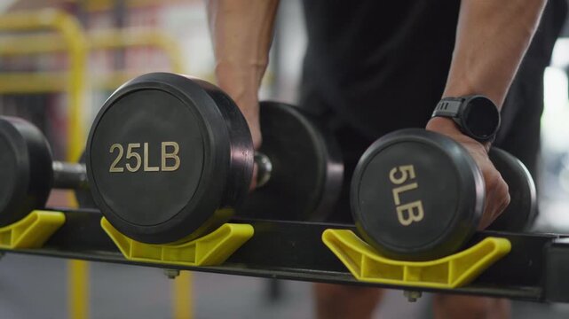 Weightlifting action gym fitness equipment indoor environment close-up view strength training concept