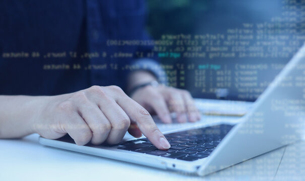 close up computer programmer man hand typing configuration on keyboard at laptop for input coding language to software for fix bug and defect of system in data center room , engineering and technology