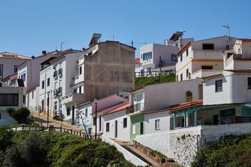 Fototapeta premium Sunlit hillside village houses in Portugal