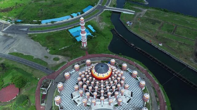 Aerial Coastal View of 99 Domes Mosque in Makassar by Losari Waterfront with CPI makassar as background, masjid kubah 99 makassar.
