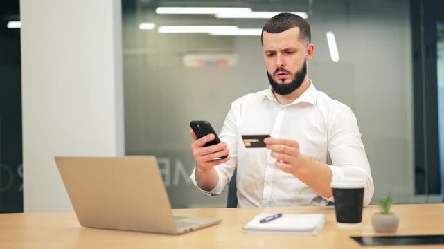 Banker experiences frustration, attempting online payment with credit card and smartphone. Expresses confusion with transaction issues within modern office, seeking solution for digital purchase.