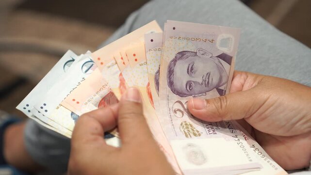 Banknote counting Singapore dollars SGD, Singapore money for payment