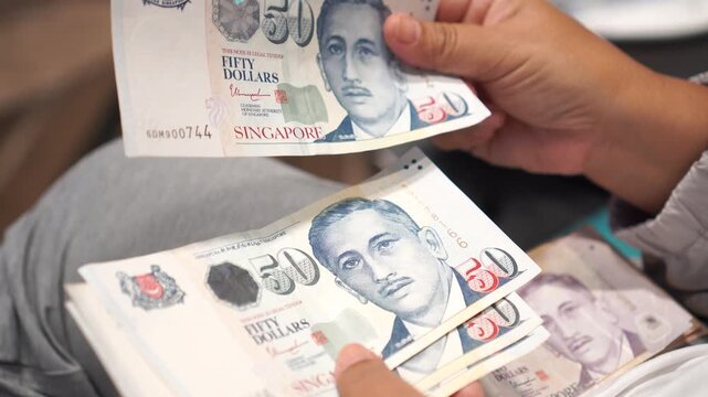 Banknote counting Singapore dollars SGD, Singapore money for payment