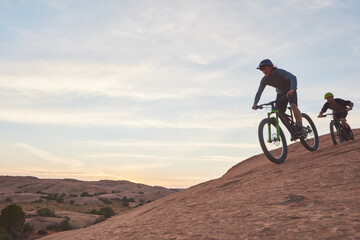 Obraz premium Mountain bike, men and adventure for fitness, cardio and extreme sports with hobby. Travel, healthy people and friends with training, cyclist and journey to explore, adrenaline and power performance