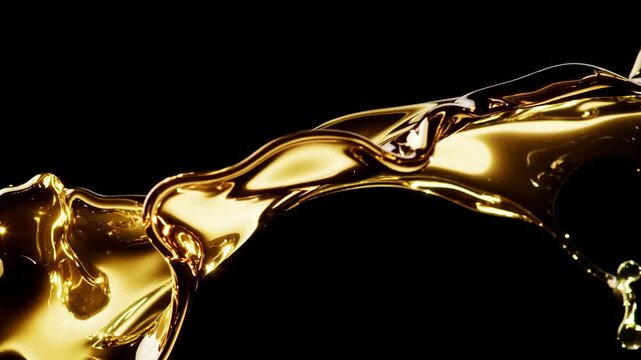 Golden liquid flowing on black background, slow motion metallic fluid splash, luxury cinematic footage