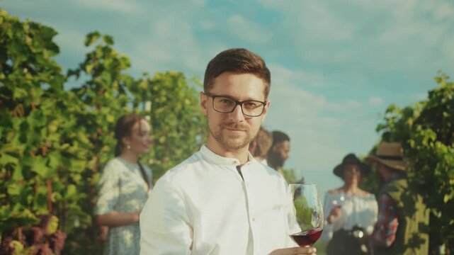 Sommelier inspecting wine amid vines, Sunlit vineyard ambiance featuring expert wine evaluation and celebration