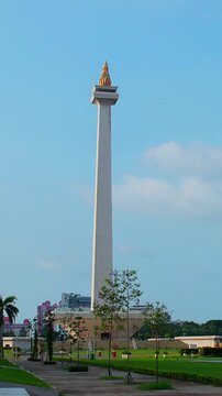 Timelapse of Monas or National Monument standing with clear sky. National Monument is Jakarta's famous landmark.