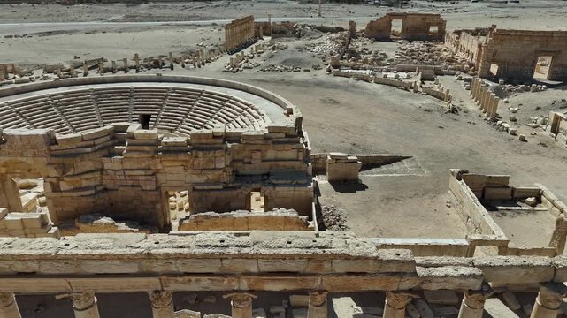 Stunning high-angle drone perspective of the historic Roman Theatre in Palmyra, a UNESCO World Heritage site