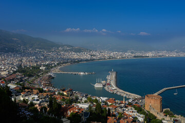 Fototapeta premium Panoramic Aerial View of Alanya City Harbor and Red Tower, Kizil Kule Landmark, Turkish Riviera Landscape with Mediterranean Sea, Antalya Coastline. Urban Travel Concept, Ancient Turkish Castle