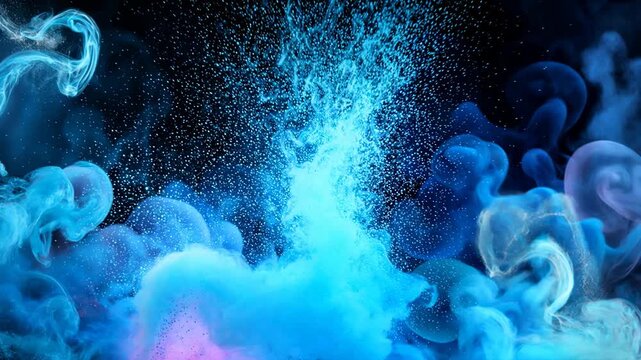 Blue swirls of thick smoke and liquid splashes rotate in the dark before a powerful explosion of bright glowing particles and powder bursts outward