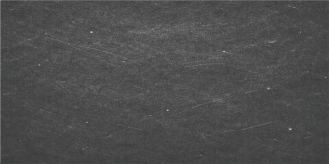 Fototapeta premium A textured, dark grey chalkboard background, suitable for adding text or other design elements, showcasing a subtly aged and weathered surface.