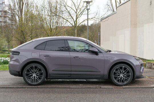 Nancy, France - March 28th 2026 : View on a purple Porsche Macan finished in Provence parked on a street.