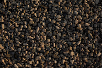 Fototapeta premium Pebble Stone Texture Background on Beach. Natural Marine Surface. Small Rocks Pattern. Sea Coast Texture Concept