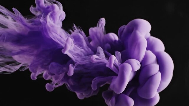 A vibrant purple cloud of liquid paint gracefully swirls and expands in dark water, creating an abstract and dynamic visual effect