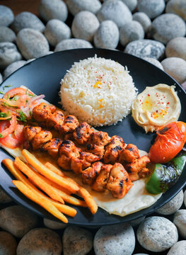 kebab, Chelo Kabab, shishkabob, home-cooked on the grill fire meat beef shish kebab with vegetables, grilled meat skewers, grilled tomatoes and peppers