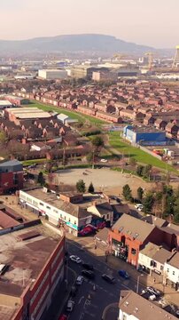 Approaching 60FPS vertical social ratio aerial video of C.S. Lewis Square on the Newtownards Road in East Belfast, Northern Ireland. Produced in 1080x1920 with Rec709 color.