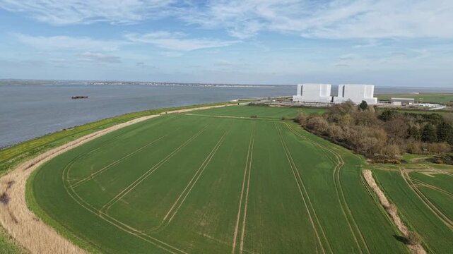 Bradwell nuclear power station UK undergoing decommissioning aerial push shot