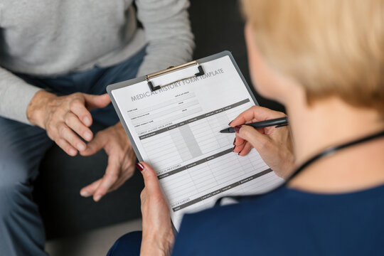 Doctor meets patient at home for health consultation and medical checkup