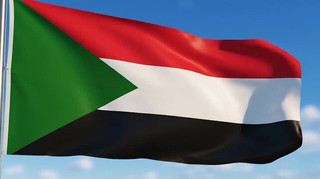 A national flag with horizontal stripes of red, white and black and a green triangle on the hoist side, waving against a clear blue sky