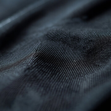 Dark fabric texture close-up in realistic style elegant background