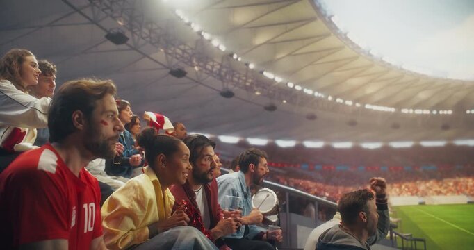 Diverse Fans in a Stadium Scream With Joy at a Soccer Championship Event, Their Team Won in a Professional Sport Aren. Goal Score and Supporters Cheer, Celebrate. Static Side Shot Slow Motion