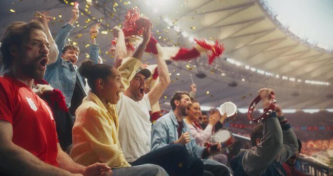 Diverse Fans Cheer and Celebrate in a Packed Stadium During a Soccer Championship Sport Event, Supporting Their Team in a Professional Arena as a Decisive Goal Sparks Joy at a World League Match.