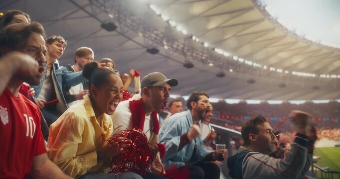 Diverse Fans in a Packed Stadium Cheer and Celebrate a Soccer Goal During a Championship Sport Event, Supporting Their Team in a Professional Arena at a Major International League Final Match.