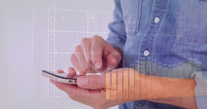 Tapping hands using phone screen against plain backdrop, showing floating charts over denim cuff