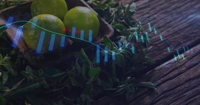 Displaying three green limes in wooden bowl on weathered table, with blue candlestick overlay