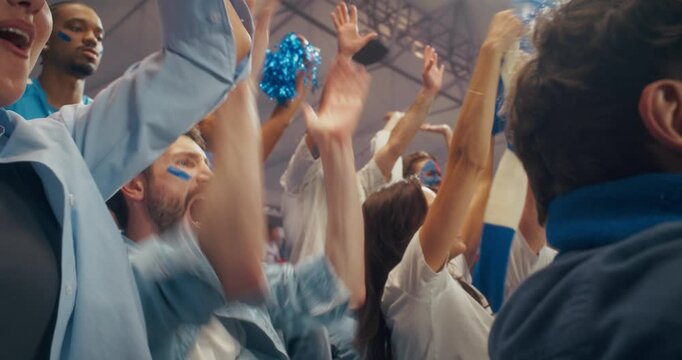 Close-up of Joyful Football Supporters in a Packed stadium as Diverse Group of Fans Celebrate Team Victory at Professional International League Match, Cheering From the Arena Stands
