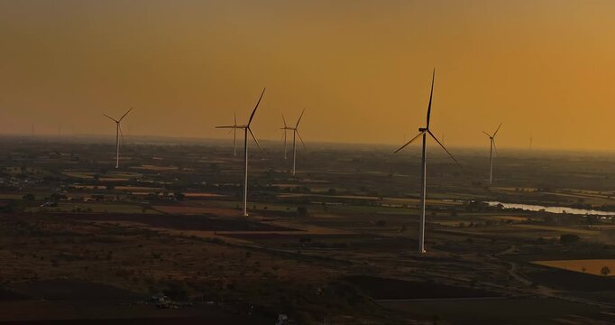 Aerial view of Windmills/ Wind Turbines Operating in Rajkot, Gujarat, India. Renewable energy, Wind Energy Production, Wind Farm in India, Developing India Concept 