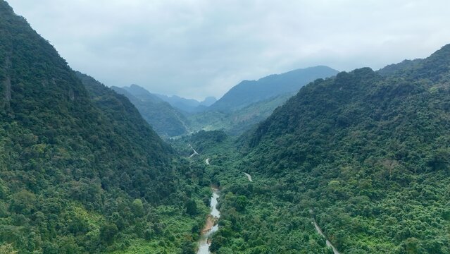 Bo Trach, Quang Binh (Quang Ngai), Vietnam: 4K aerial drone footage of Phong Nha &ndash; Ke Bang National Park, UNESCO karst mountains, limestone cliffs, rive, tropical forest, misty valley landscape.