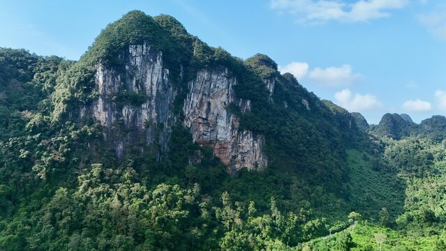 Bo Trach, Quang Binh (Quang Ngai), Vietnam: 4K aerial drone footage of Phong Nha &ndash; Ke Bang National Park, UNESCO karst mountains, limestone cliffs, rive, tropical forest, misty valley landscape.