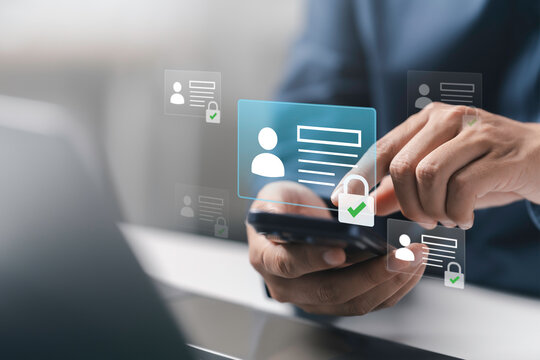 ID security, personal data protection, and digital identity safety Concept. cybersecurity. Businessman using smartphone with virtual identity card icons and data lock.