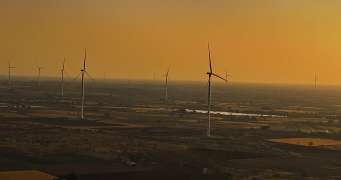 Aerial view of Windmills/ Wind Turbines Operating in Rajkot, Gujarat, India. Renewable energy, Wind Energy Production, Wind Farm in India, Developing India Concept 