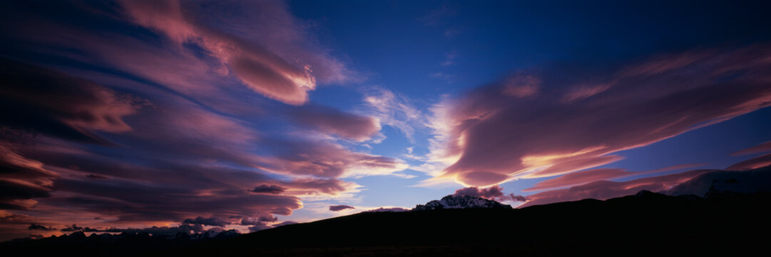 Panoramic view of pink clouds in dramatic sky over Mt Fitzroy, Patagonia

