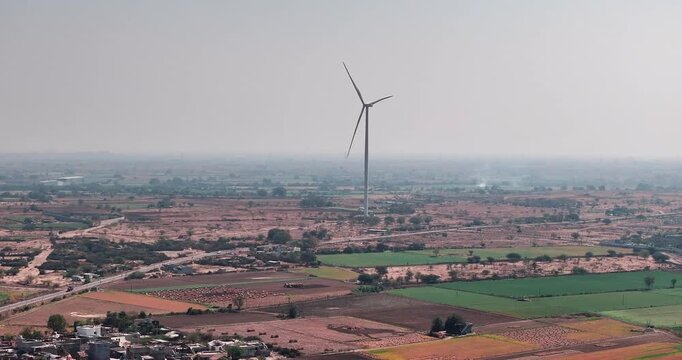 Aerial view of Windmills/ Wind Turbines Operating in Rajkot, Gujarat, India. Renewable energy, Wind Energy Production, Wind Farm in India, Developing India Concept 