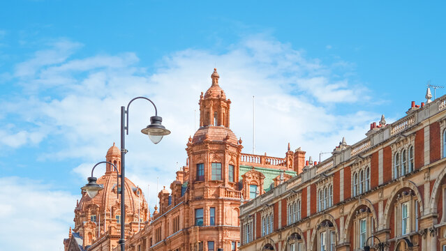 Historic architecture of red brick buildings under clear blue sky