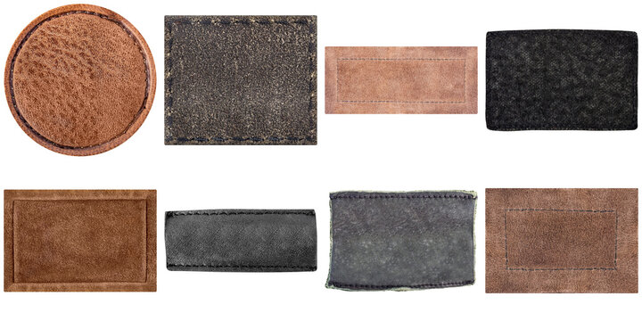 Collection of diverse genuine leather labels and patches in various earthy tones and textures, featuring stitched edges.