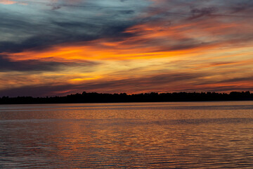 Fototapeta premium Colorful sunset over the lake. Mietkowski Lake, Poland