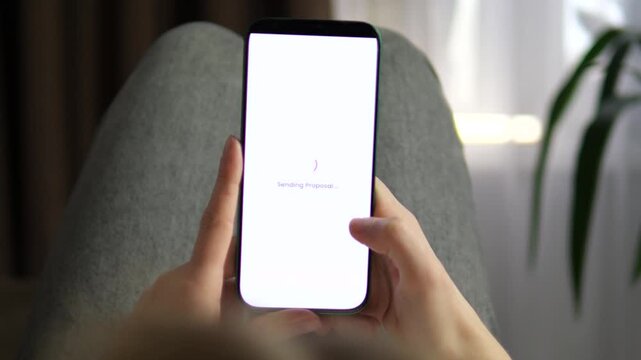 Close-up of a person using an influencer marketing app to send a collaboration proposal. Features a clean UI with creator stats and a successful Proposal Sent confirmation. Perfect for digital
