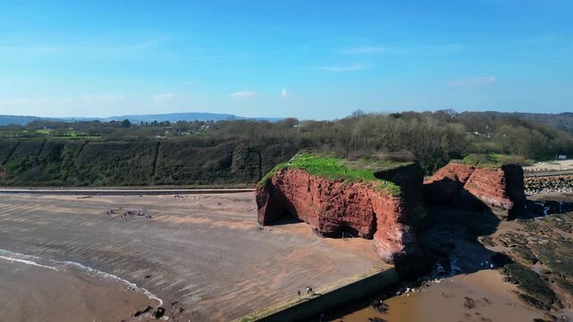 Dawlish Warren, Devon, England: DRONE VIEWS: Red Rock (Langstone Cliffs); Mainline railway track; in the background are Dawlish Warren and Exmouth. South Devon is a popular UK holiday destination.