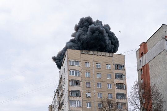 The moment of the explosion. Thick black smoke rises above the building with sparks of hot metal. The explosion was from an Iranian-Russian drone "Shahed".