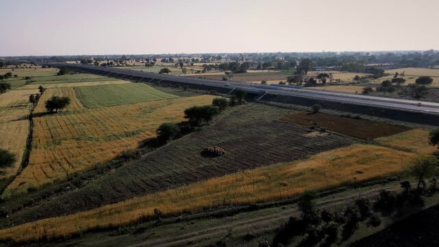 Aerial view of the Delhi&ndash;Mumbai Expressway, showcasing a modern multi-lane highway cutting through the landscape. The image highlights India&rsquo;s advanced infrastructure, smooth road network.