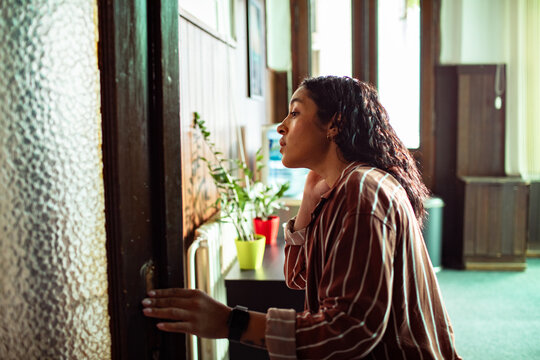 Woman arriving at group therapy meeting in a counseling center