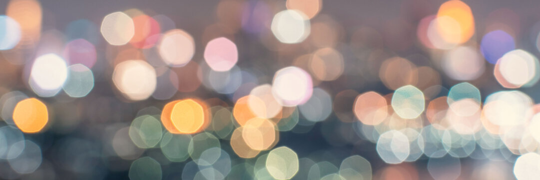Bokeh blurred background city night light or blurry octagon bokeh abstract candlelight party in vintage style purple blue green yellow orange gold color